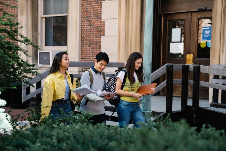 University students walking together outside a campus building